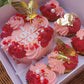 Valentine's Day Cake Bento Box with 'I Love You' cupcakes, colorful butterflies, pink and red sprinkles, and a 'Happy Valentine's Day' message.